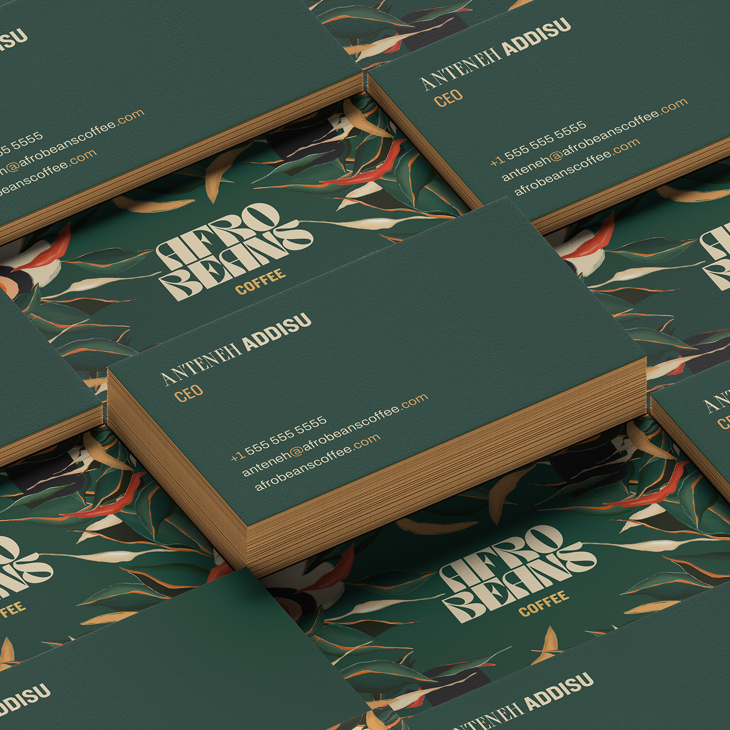 Forest-green business cards with illustrated backs and cream lockup