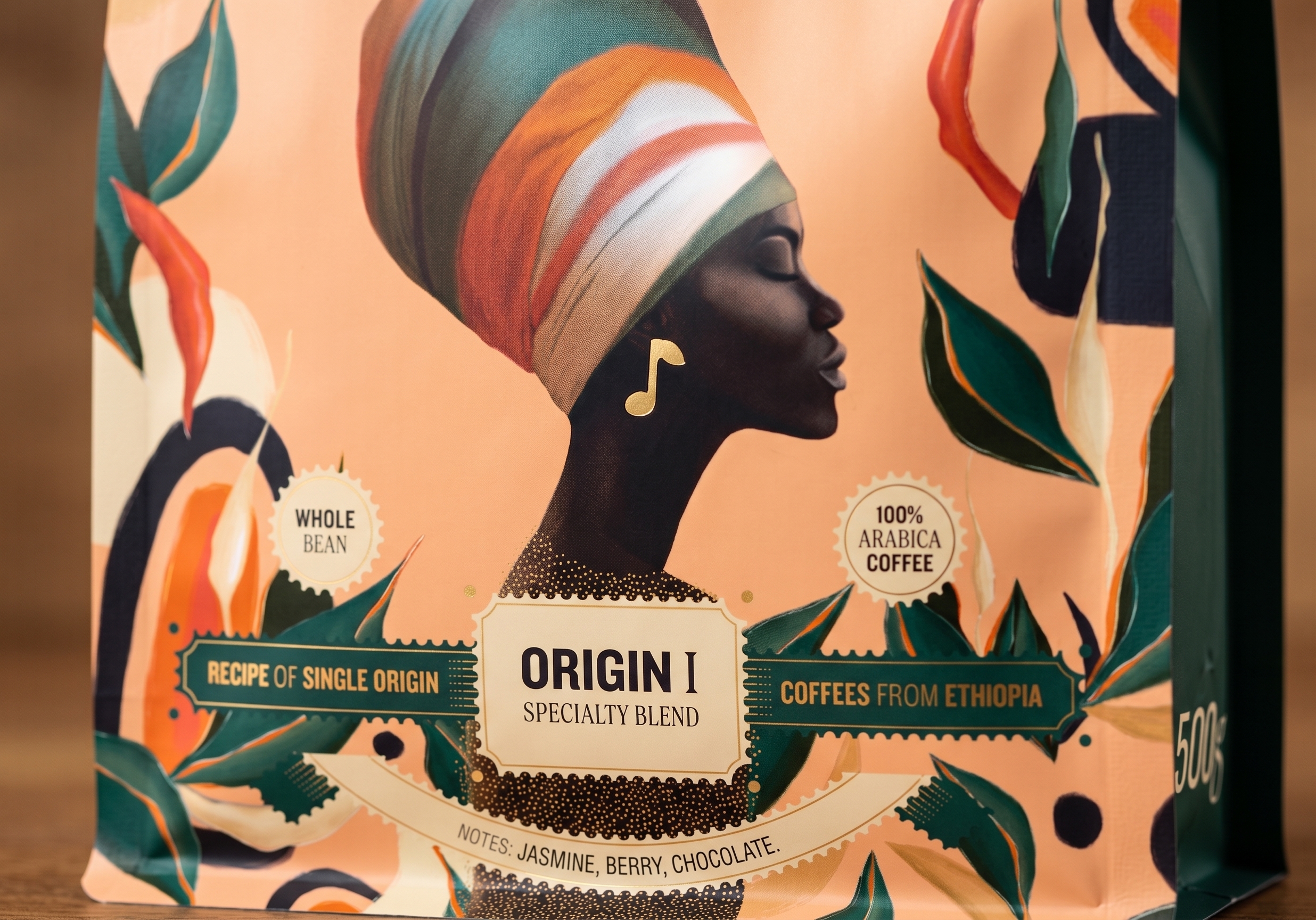 Close-up of the illustrated portrait and Origin I labels on the pouch