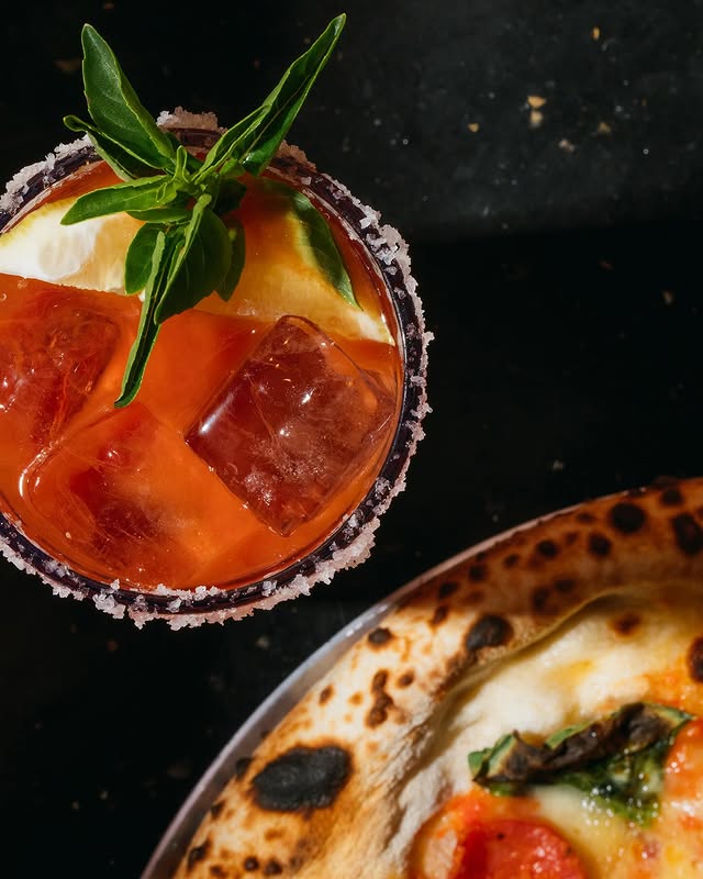 Overhead cocktail and Neapolitan pizza