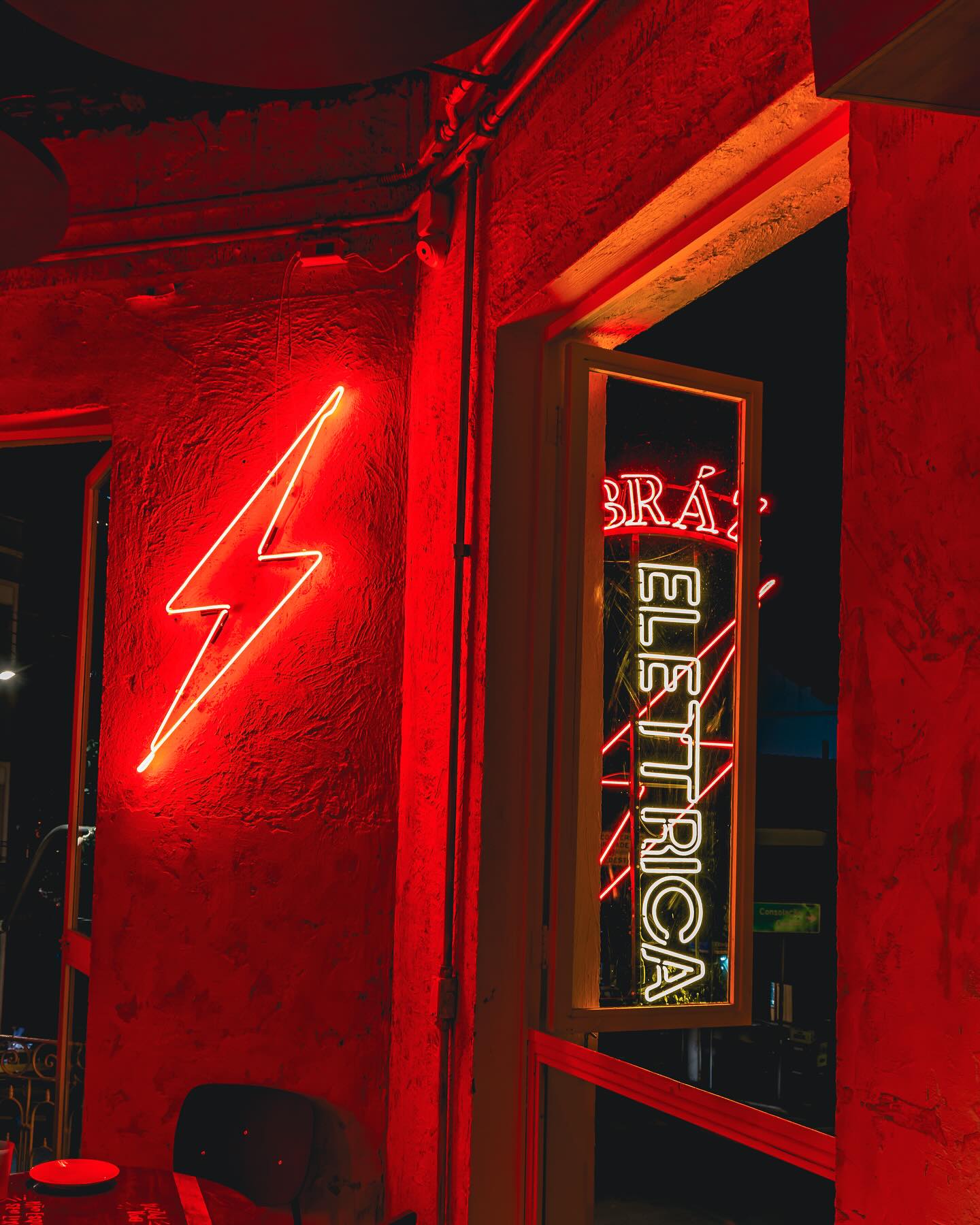 Interior lightning-bolt neon with the exterior wordmark in the window