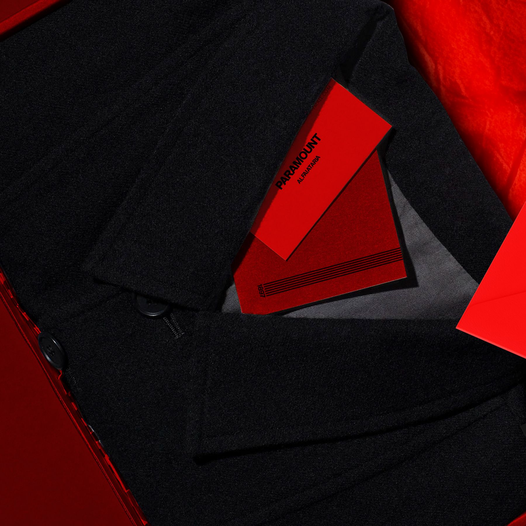 Paramount Alfaiataria garment packed in a red box with brand cards